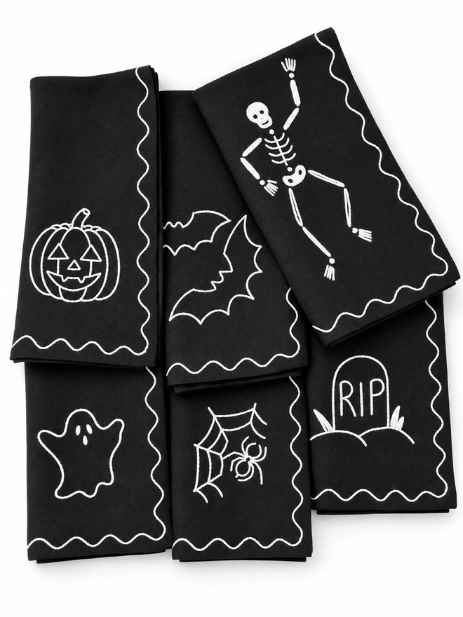 Black napkins with white embroidered Halloween 