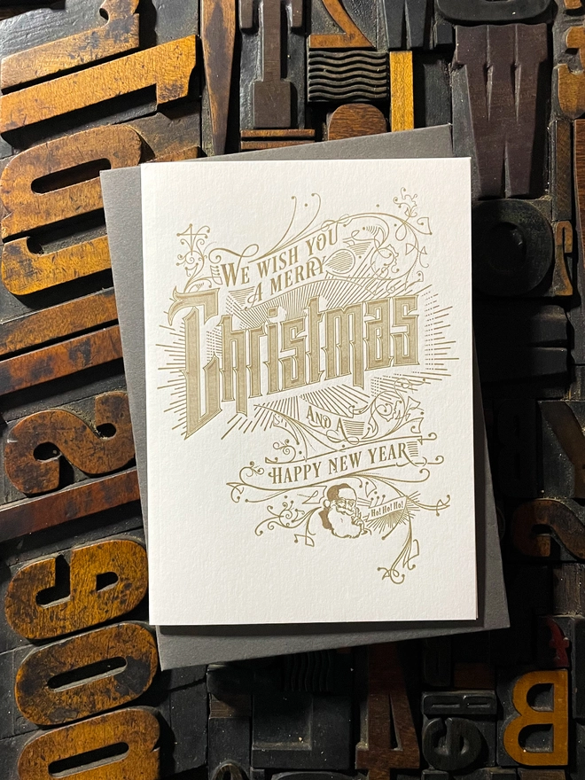 Spread festive cheer with this charming vintage Santa letterpress Christmas card! These cards are printed with my own fair hands on my 1915 Arab Crown Folio Press. Printed in metallic gold ink.