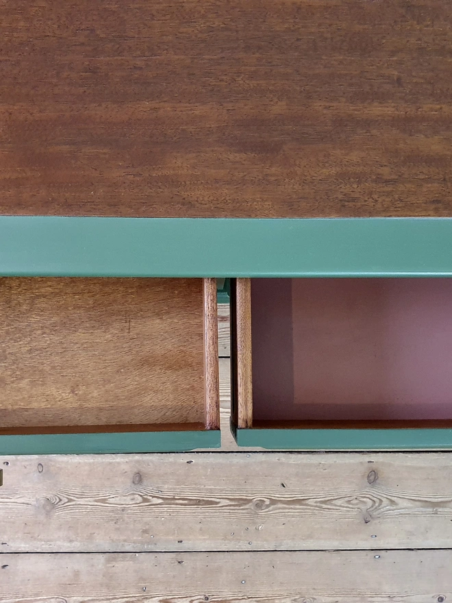 Top and inside drawers of green and pink dressing table