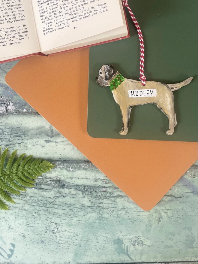 Border Terrier Hand- Painted Hanging Christmas Dog Portrait with the name "Mudley" Painted on 