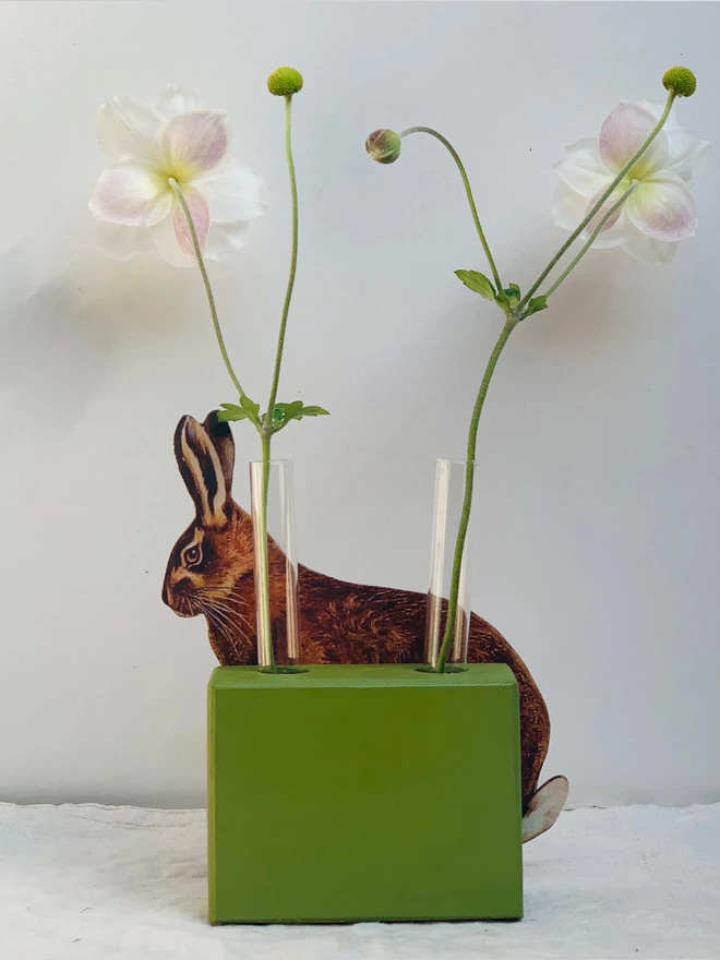 Vase with hare and two test tubes.
