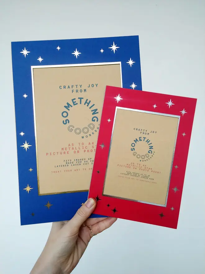 metallic star a5 / a4 christmas photo mount. red mount photographed against grey background.