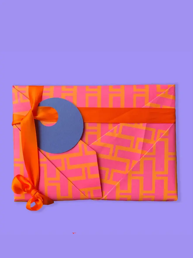 Geometric Bricks Pattern Wrapping Paper, against a purple background. 