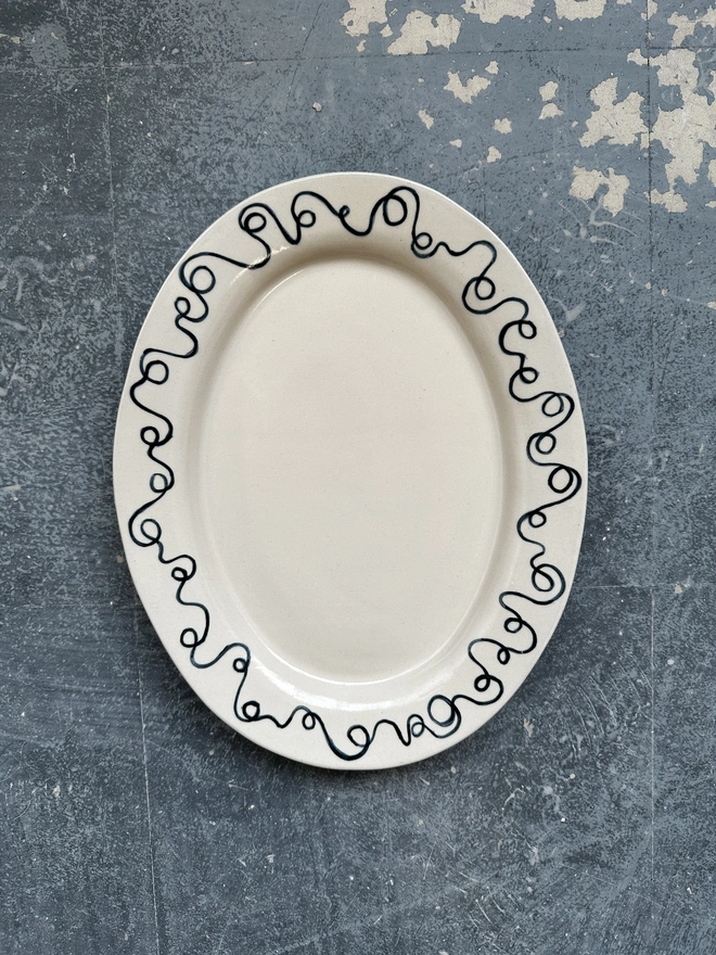 A platter with a decorated rim