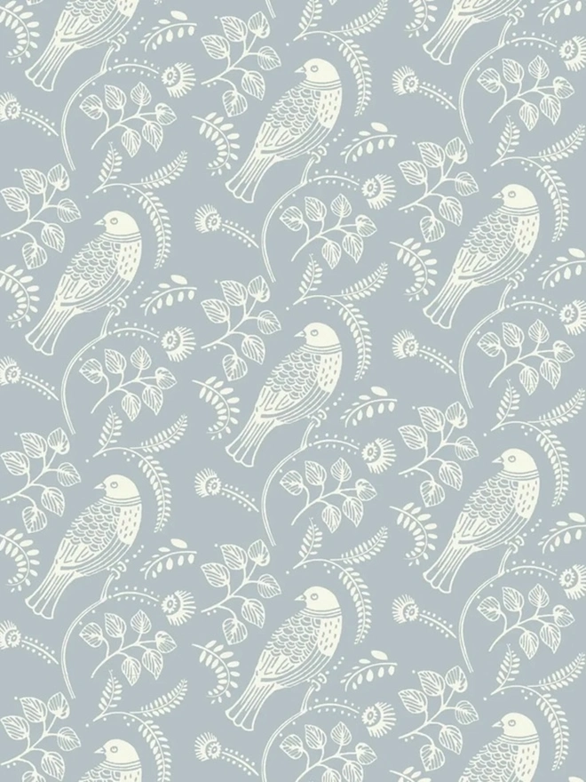 Tuvi Patterned Paint Roller, a turquoise and white floral pattern painted on a wall. 