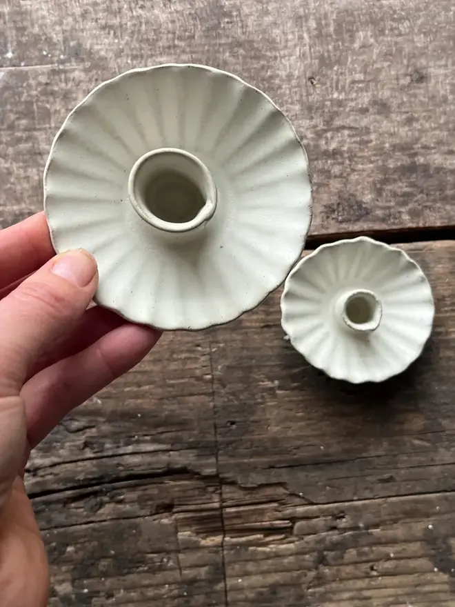 Handmade White Ceramic Candlestick Holder, a pair of white candle holders sitting on a wooden surface. 