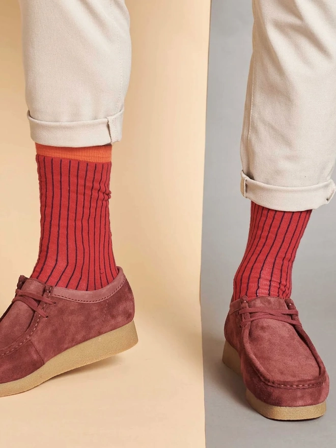 Men's Organic Cotton Ankle Socks Packs (Sets Of 3), a man wearing a pair of colourful patterned socks. 