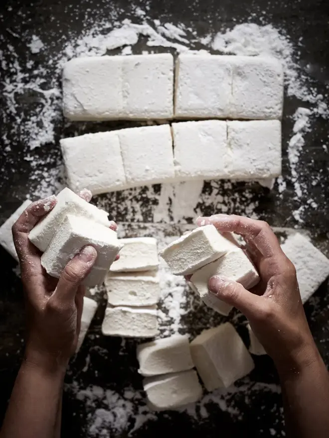 Vanilla Bean Jumbo Mallows (Pack Of 4), a group of marshmallows on a stone surface. 