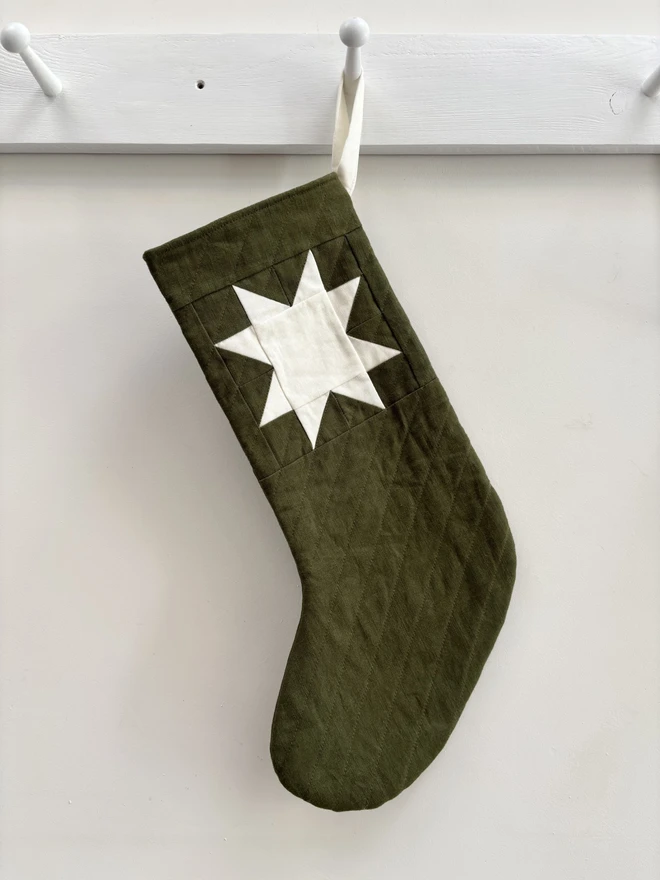Medium Star Quilted Linen Christmas Stocking with Ivory Linen Patchwork Detail. A green stocking.