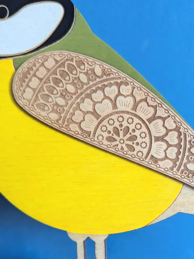 Standing Wooden Great Tit, yellow wooden bird decoration standing on a platform. 