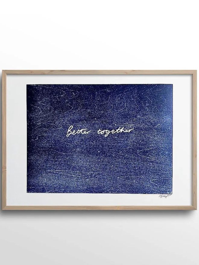 Better Together Woodcut hanging up in a wooden frame