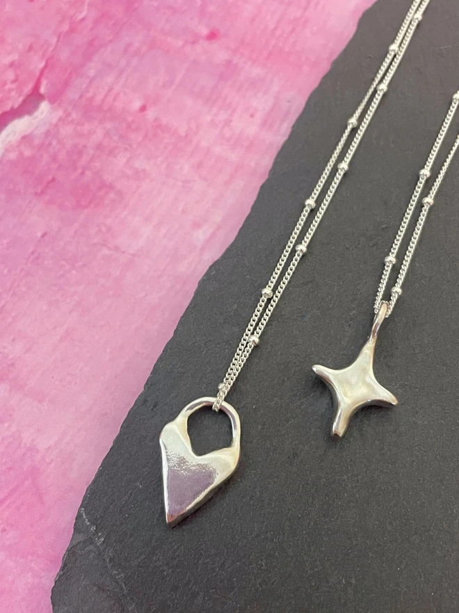 Hand made star charms made from 100% recycled sterling silver, cute gift for girlfriend or wife for Valentine's Day or Mother's Day. Add a personalised initial and send straight to your special someone. Made by Celina C Jewellery, a small business in the UK, find on Holly and Co.