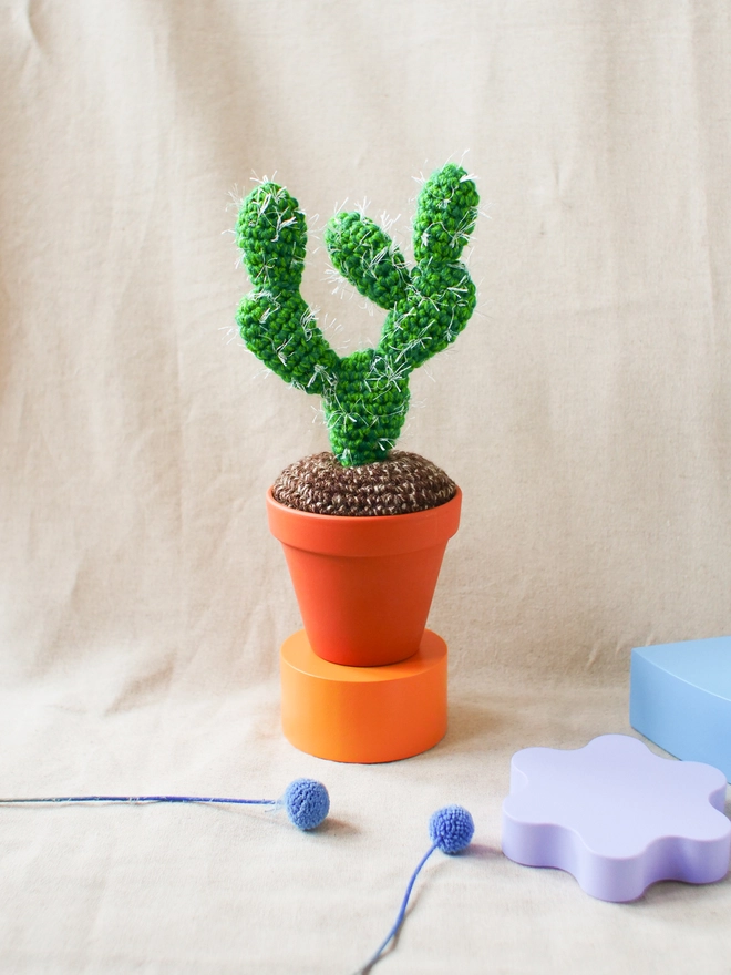 Handmade spiky crocheted cactus in terracotta pot
