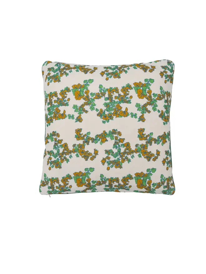 white floral cushion on blank background