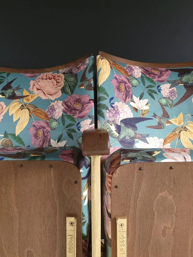 Swallows and Blooms floral velvet on a pair of cinema seats with gold cast iron