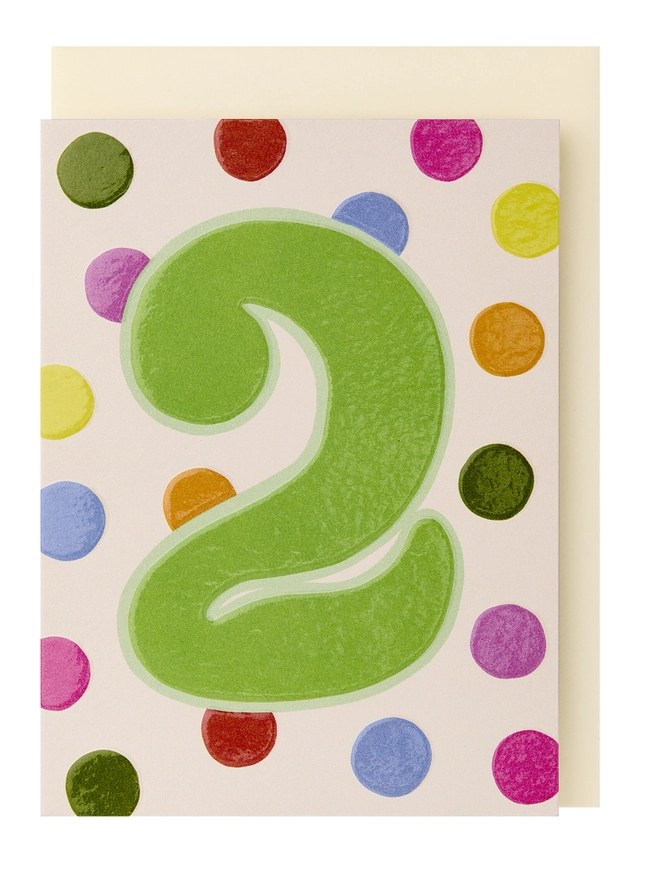 A colourful polka dot card with a large green 2 in the centre