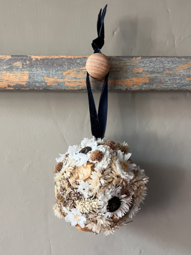 White Dried Flower Bauble. A bauble made of dried, seasonal, white flowers.