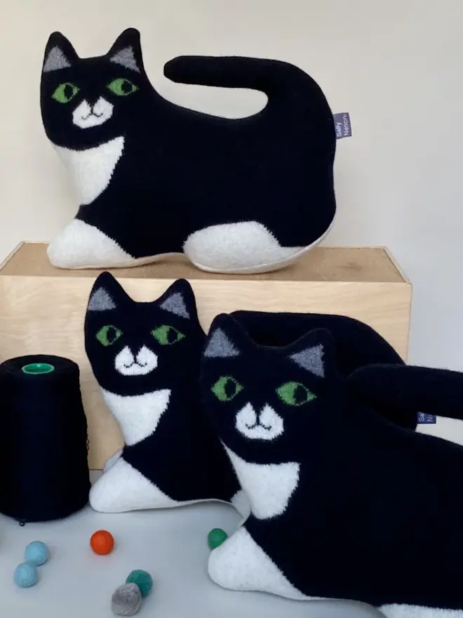 three plush black cat toys