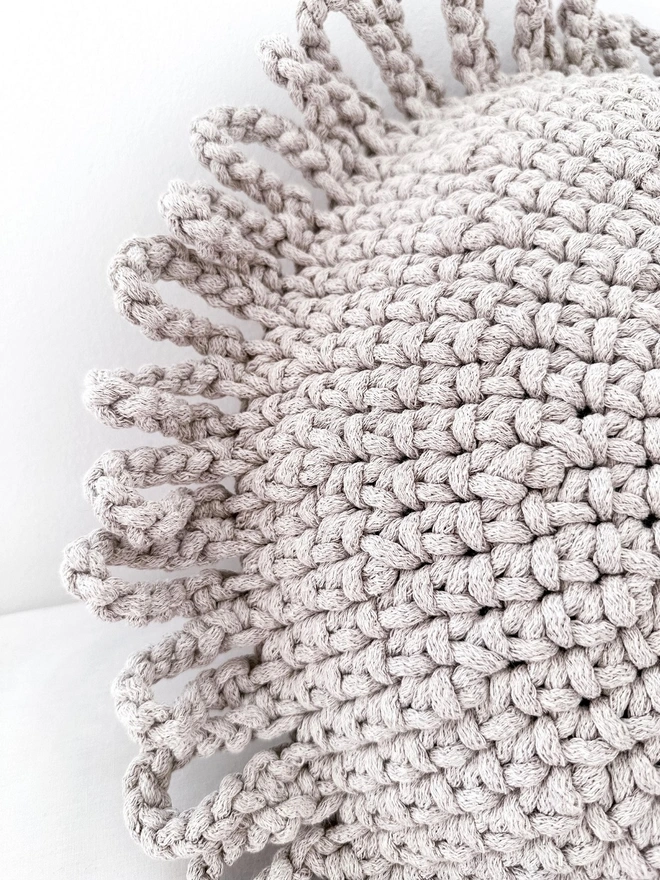 neutral sun crocheted cushion