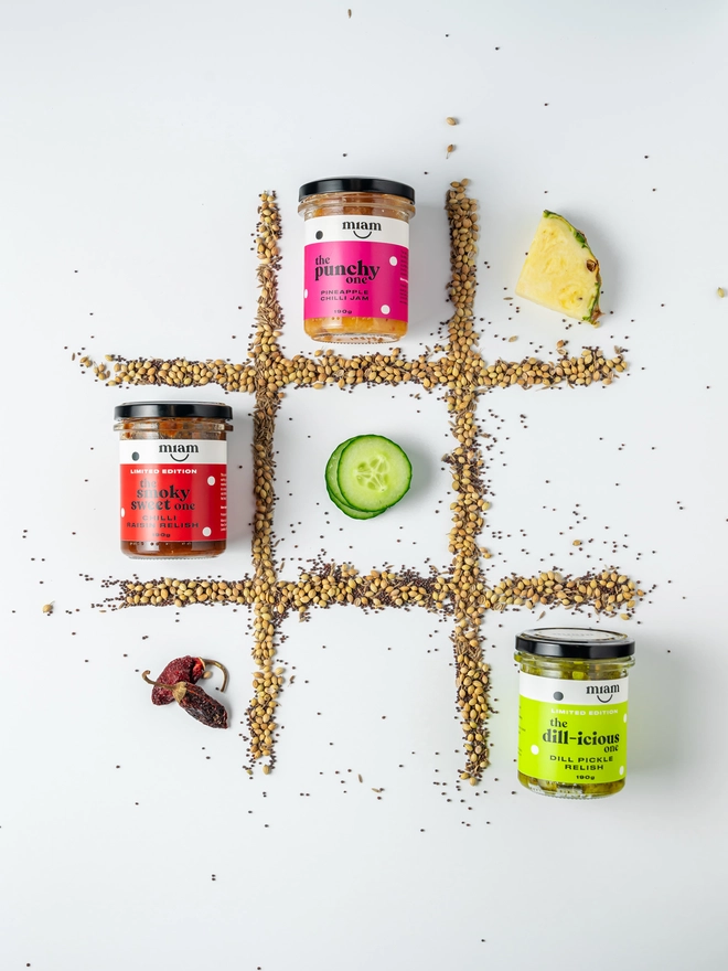 trio of jars on a noughts and crosses board