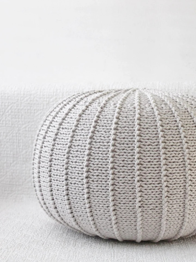 Zuri House. Large oatmeal knitted pouffe.