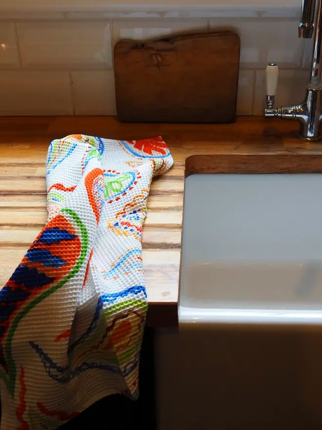Paisley Waffle Tea towel, placed on the counter. 