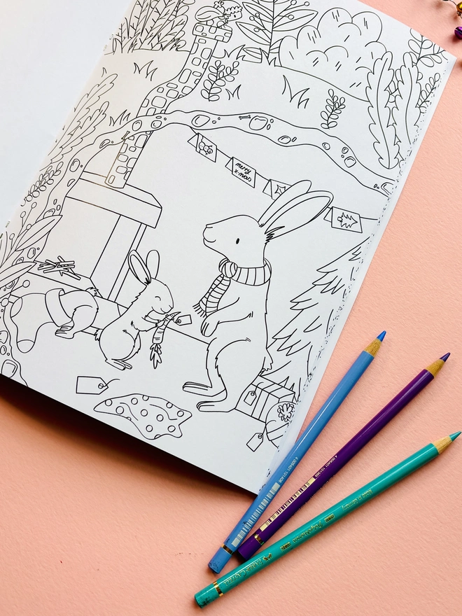 Christmas colouring book for adults and kids featuring woodland animals and winter scenes.