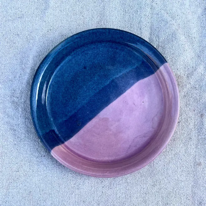 Landscape Side Plate, a colourful plate placed on a stone surface. 