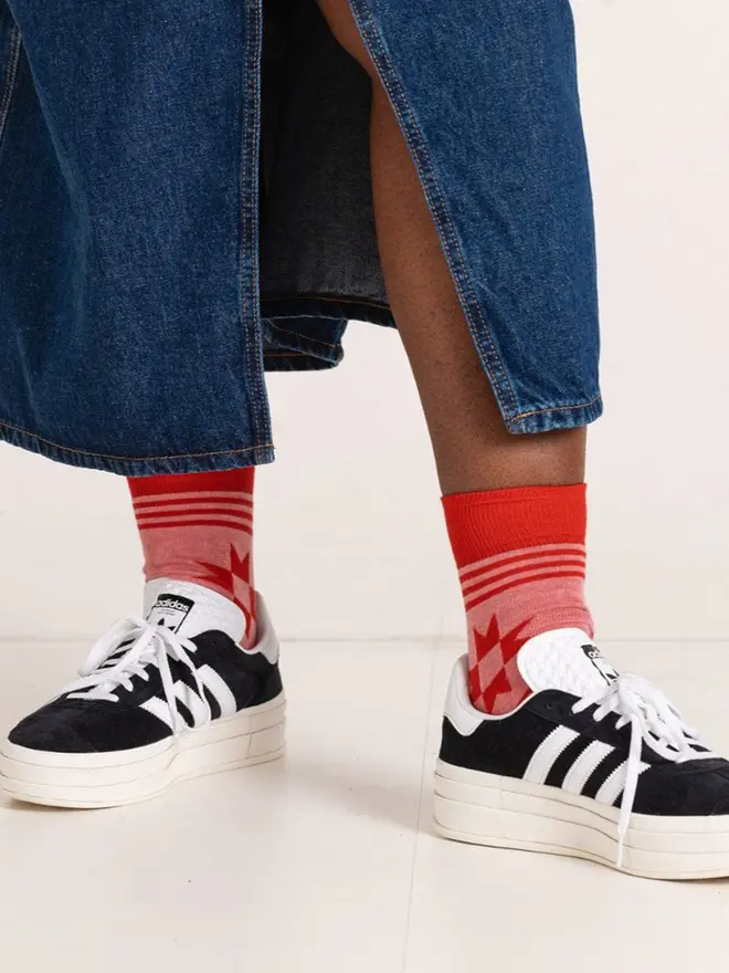 model wearing the red patchwork socks