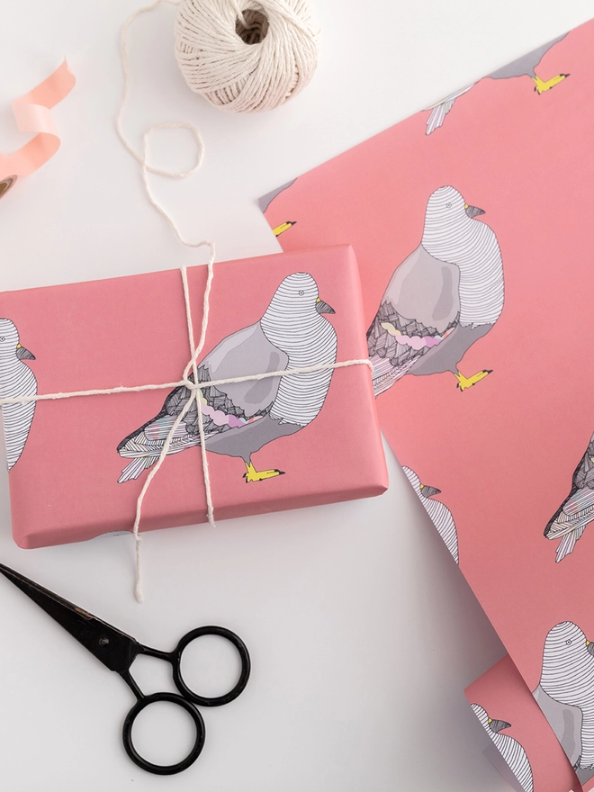 Pink gift wrap featuring pigeons 