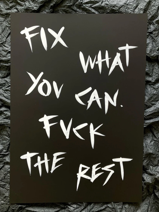 'Fix What You Can' painting. White ink on black paper.