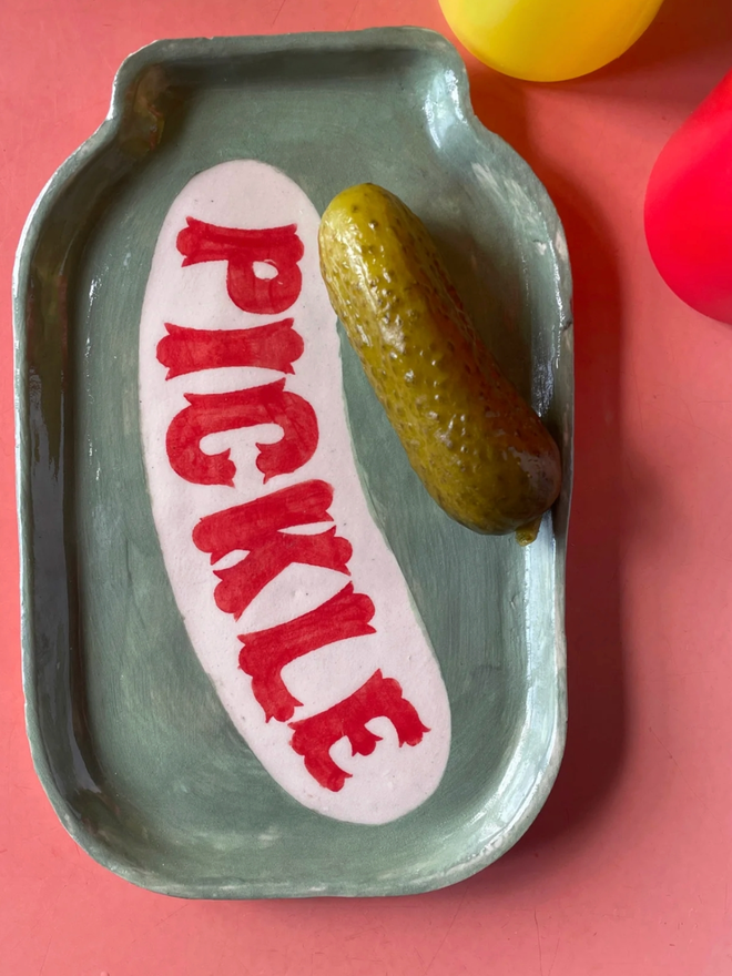 Pickle Dish. A plate shaped like a jar of pickles.