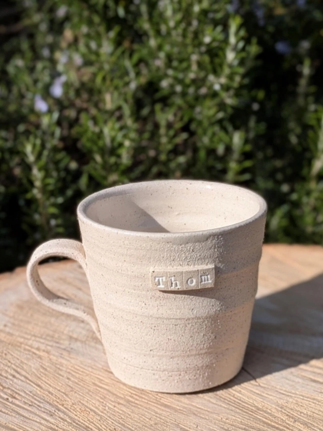 Personalised Ceramic Tea Mug. A mug in raw speckle.