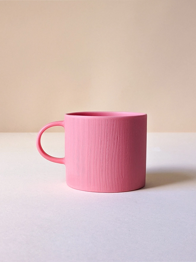 Small Porcelain Coffee Cup in Milkshake Pink with Hand Carved Combed Texture