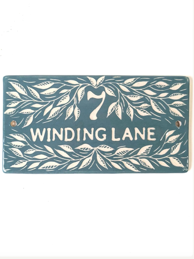 Handmade Ceramic House Plaque with Leaves. A house plaque in pine green.
