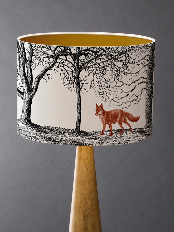 Mountain and Molehill – Foxes in winter woodland lampshade gold inner