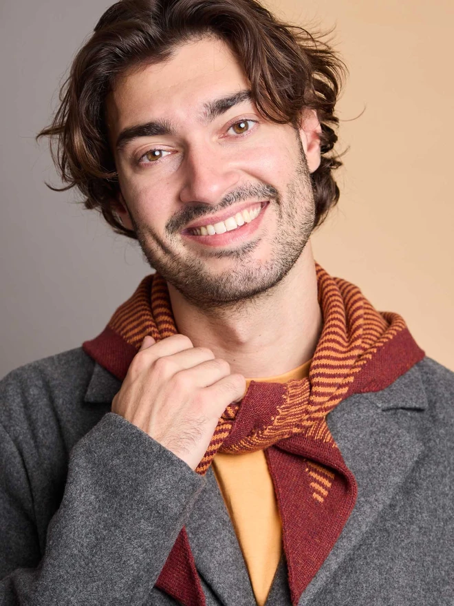 man wearing rust striped wool neckerchief