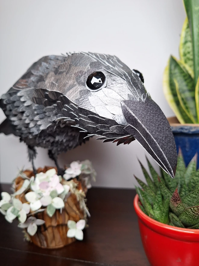 Front view of a raven handmade sculpture