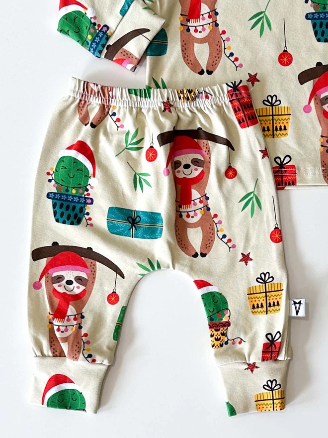 Baby and toddler lounge set with a cute festive sloth print