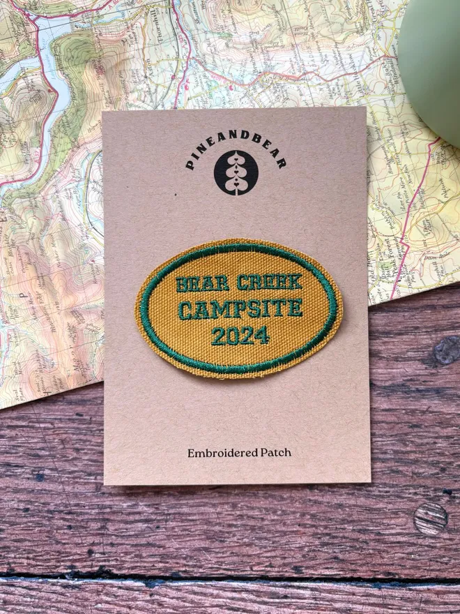 Custom location patch in navy and cream with the wording Ben Nevis laying on a vintage map