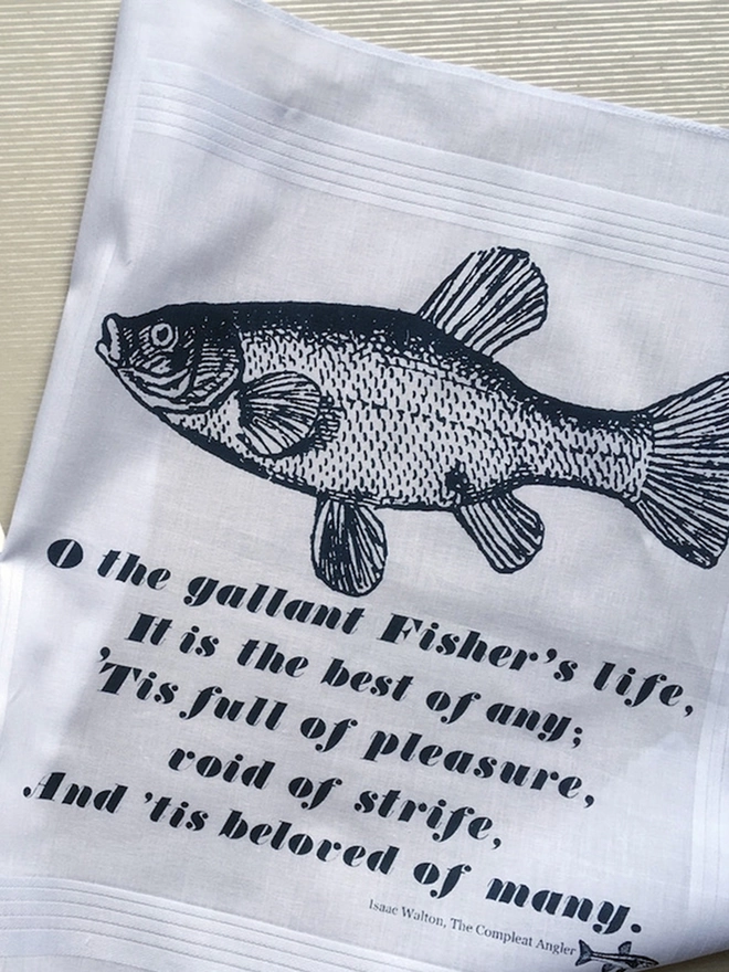 A Mr.PS Fisher Hankie laid flat to show the design and Compleat Angler quote