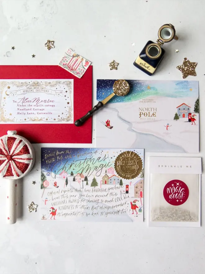 A night-sky certificate with a "Nice List Approved" seal, a North Pole Post Office card and a Magic Dust packet