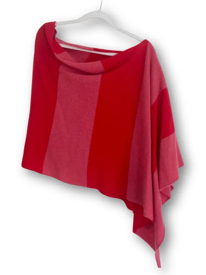 Striped poncho shown on white background