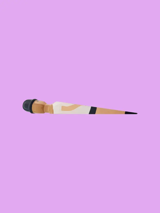 Wooden Door Stopper (Swifty Going On Outfit), a colourful wooden door stop sitting on a pink background
