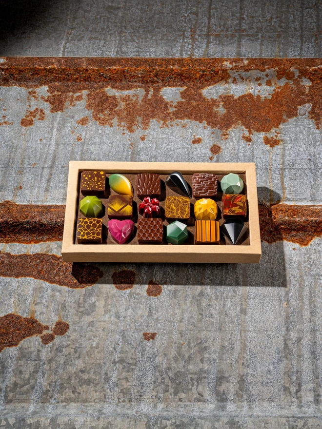 18 colourful chocolate bonbons in a brown eco-friendly box