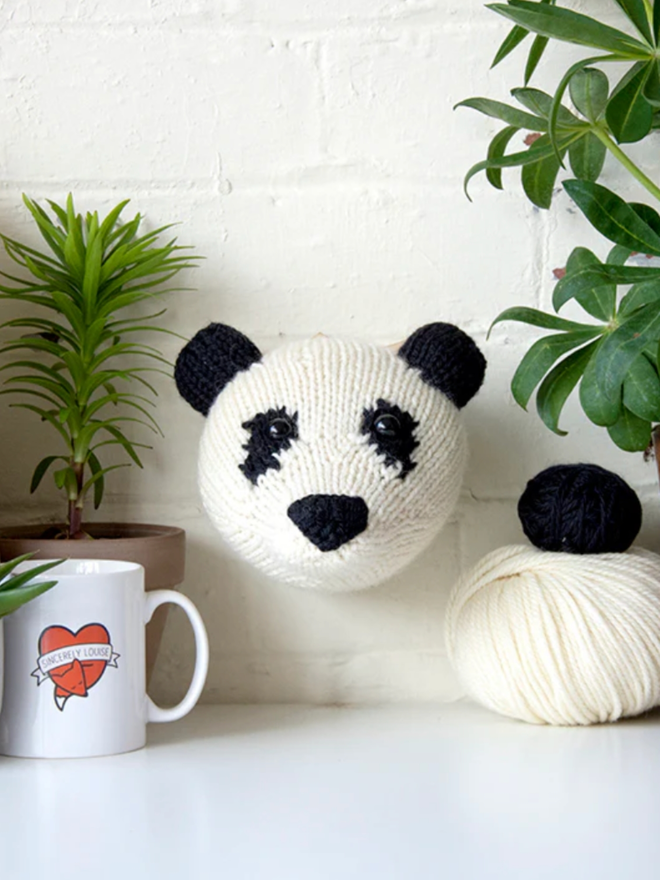 Bear Head Knit Kit. A mini panda bear head, completed and mounted.