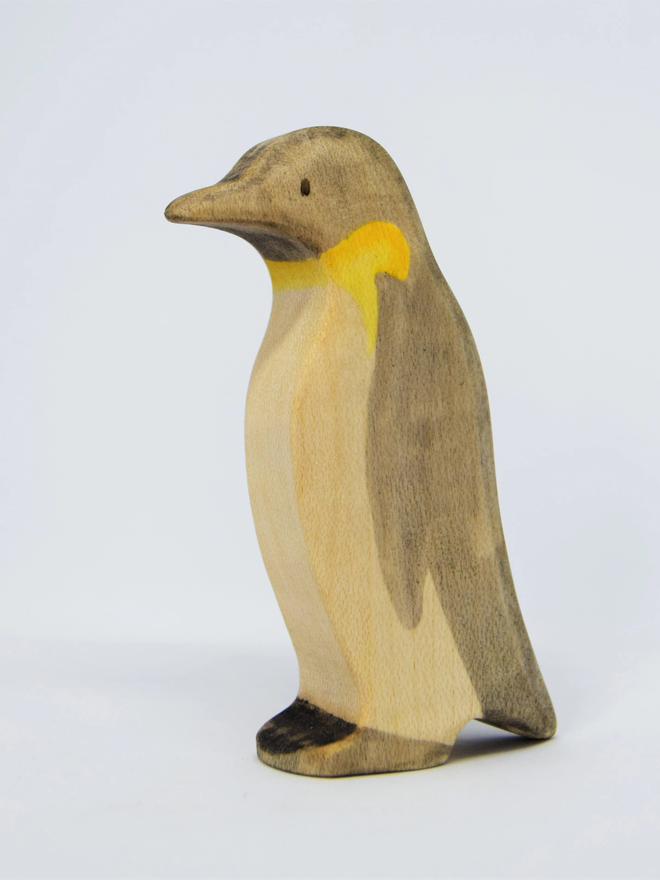 Wooden penguin with chick