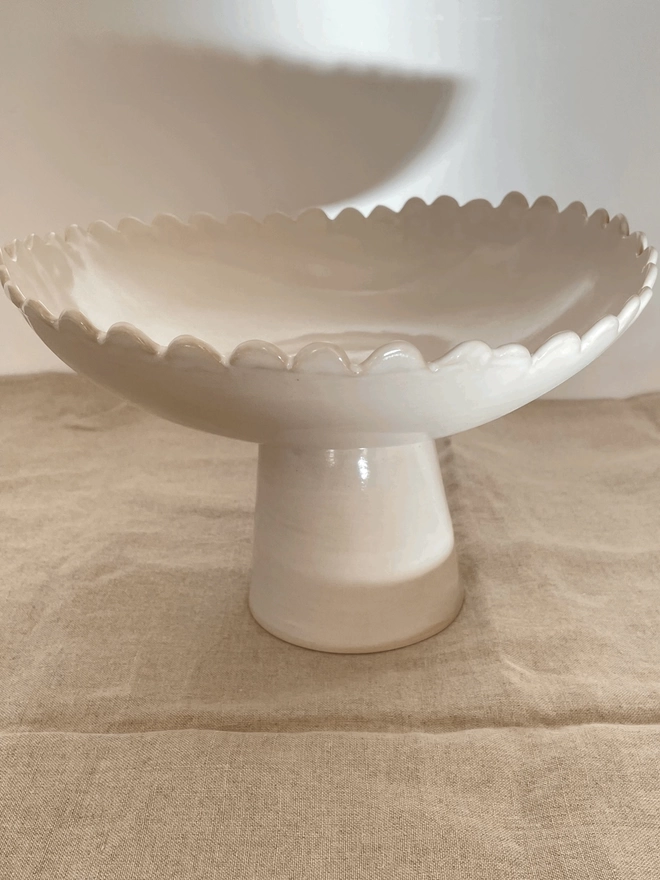 white pedestal bowl with daisy edge