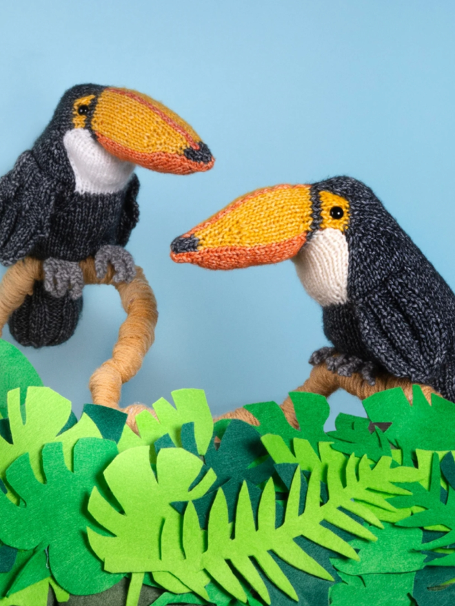 Toucan Knitting Kit. Two knitted toucans.