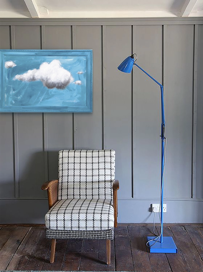 large cloud painting in turquoise painted directly onto a frame